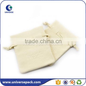 Cream color suede bag with embossed logo made in China