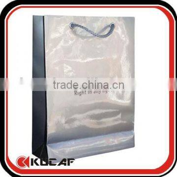 Folded shopping paper bag with pp rope