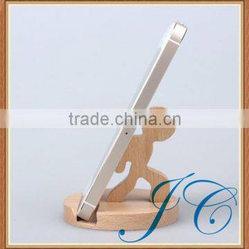 Man modeling wooden cell phone holder & mobile phone ring holder