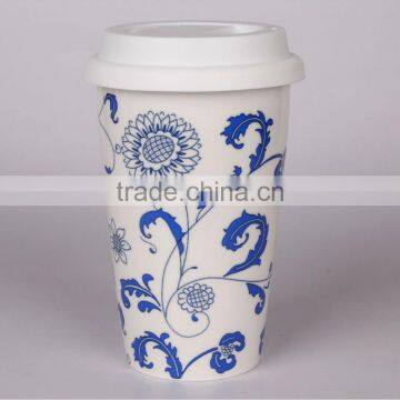 blue-and-white porcelain travel coffee mug with silicon lid