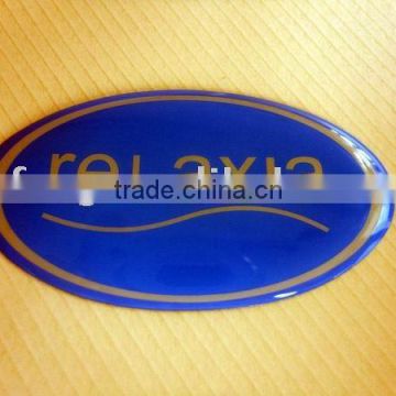 custom made oval blue epoxy logo label used