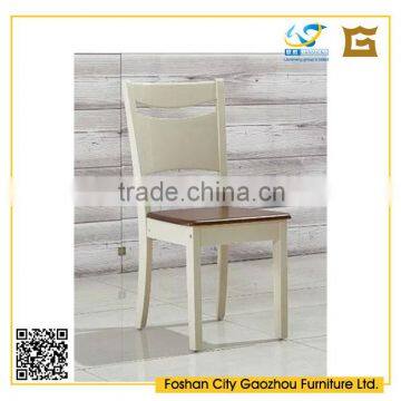 simple design white high back wooden armless dining chair in dining room