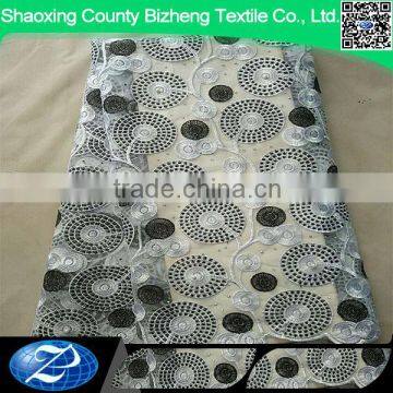 Cheap white african beaded tulle lace fabric for eveing dress styles with black circles                        
                                                                                Supplier's Choice