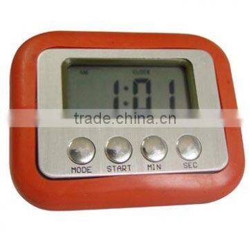 Digital clock with pencil insertedSnooze and alarm