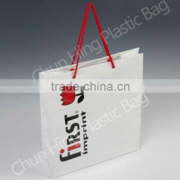 Plastic shopping bag with rope handle