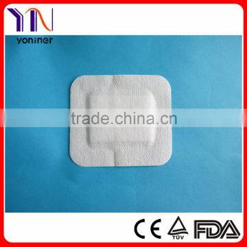 Non woven surgical adhesive wound dressing