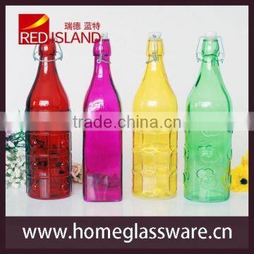 colored glass bottle with clamp lid