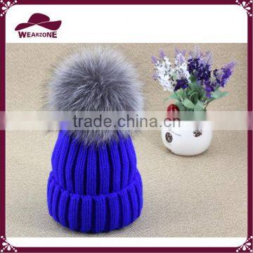 Acrylic knitted beanie with fur pom