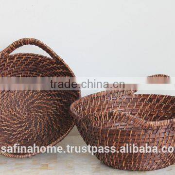 Small round rattan basket with handles
