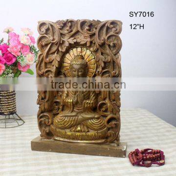 Wood carving buddha statue for desktop decoration.