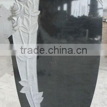 European style black granite monument with carving