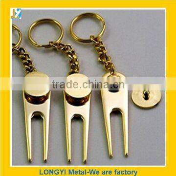 gold golf divot tool with kechain keyring