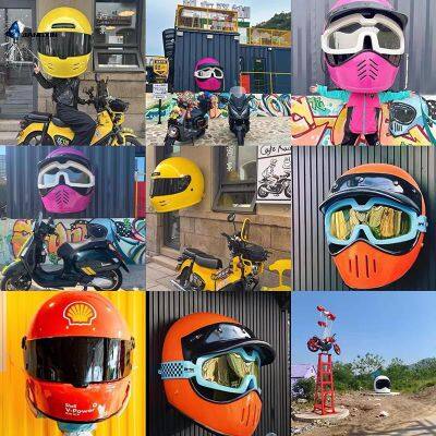 The large-scale outdoor stainless steel artistic motorcycle helmet and coffee house sculpture are handcrafted using electroplating technology.