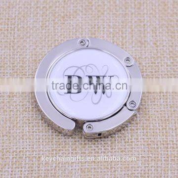 Hot sale round white bag purse hanger/ bag purse holder with epoxy printed logo