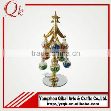 Golden handmade glass christmas tree with ornament