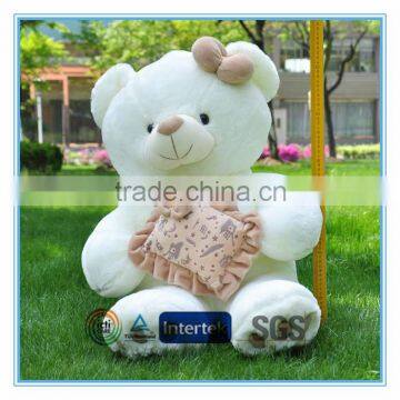 Big teddy bear with square cushion