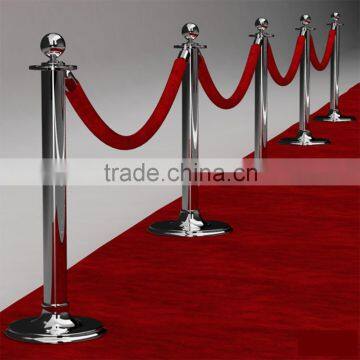 red and white rope red carpet and stands