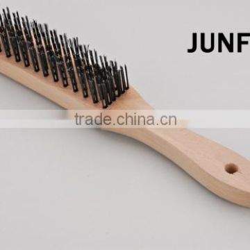 different rows wooden handle black steel wire brush