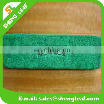 Green cotton headband with embroidered logo