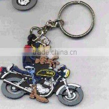 A cartoon motorcycle style key chain