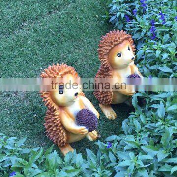 Polyresin squirrel figure in garden