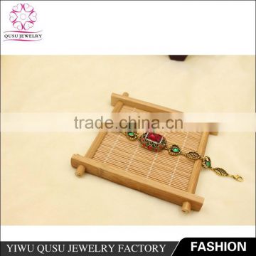 2015 Yiwu new products antique gold plated bracelet with emerald rhinestone and garnet imitation jade