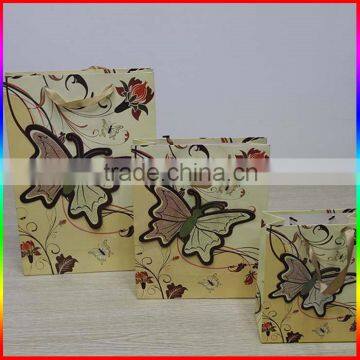 fashionable colourful paper gift packing bag with butterfly design