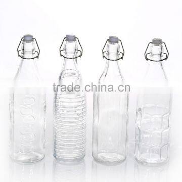 Unique Design Different Embossed Pattern Cylined Shape Clear Glass Water Bottle