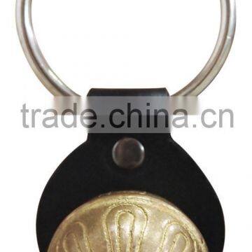 Sleigh bell with leather strap handing on the door for christmas decoration