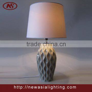 flowing ceramic base and fabric shade table lamp