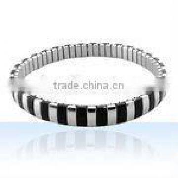 Stainless steel bangle bracelet with rubber accent