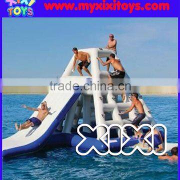 Aqua inflatable tower slide floating on water