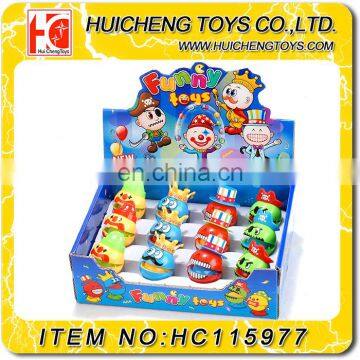 Lovely cheap small wind up jumping face expression plastic mini promotion toys for kids