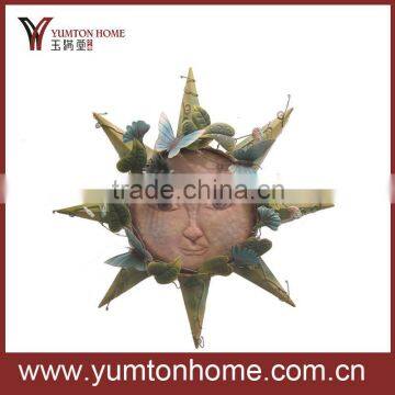 Metal sun face with butterflies wall decoration