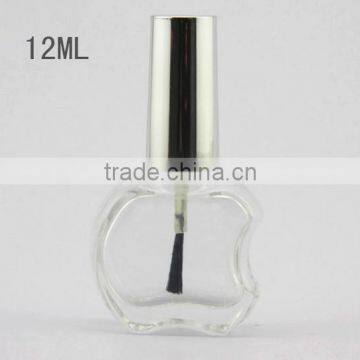 Empty glass nail polish bottle with brush cap, apple shape