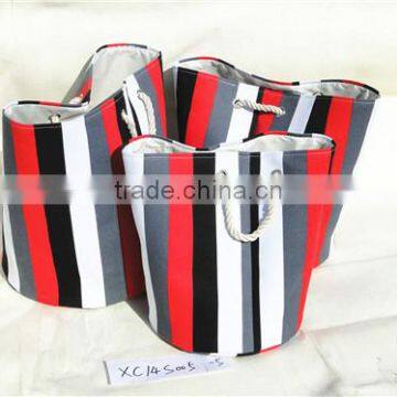 round storage and laundry basket with strip pattern and handle