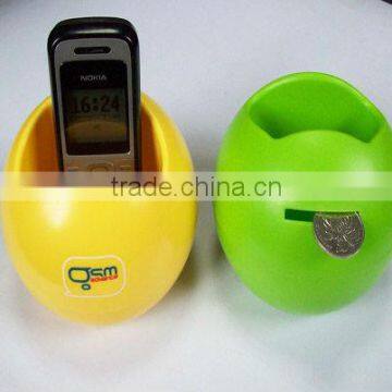 supply various cheap hot sales promotional plastic coin bank with mobile phone holder