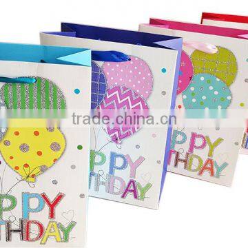 Wholesale paper packaging happy birthday gift bag with ribbon handles