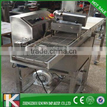 chocolate enrobing machine with three conveying belt