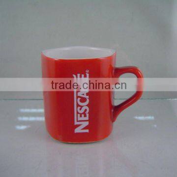 Red pentagon nestle coffee cup