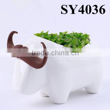 White table animal shape grass doll