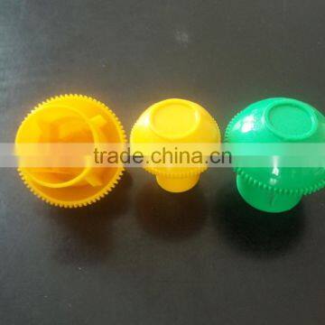 Small yellow plastic tube cap