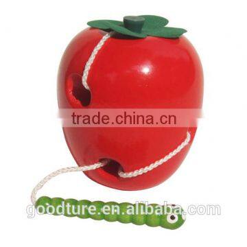 Wooden Caterpillar Eating Red Apple photo-2