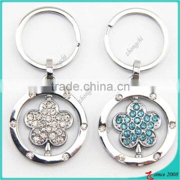 China wholesale flower charm keychain metal rotating keyring
