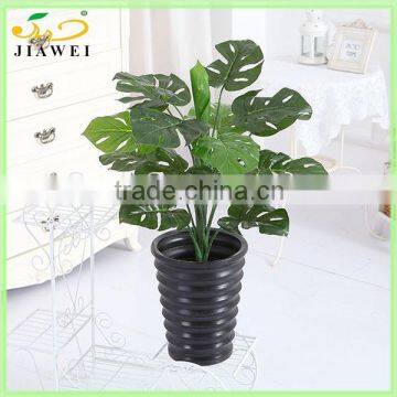 Artificial monstera leaves/flower bush