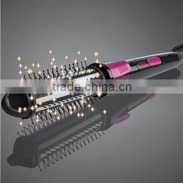 Manual rotation hair curler with comb