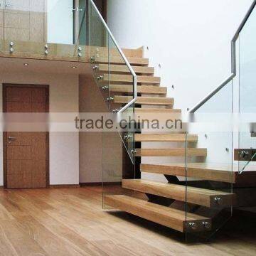 floating wood stairs with frameless glass balustrade
