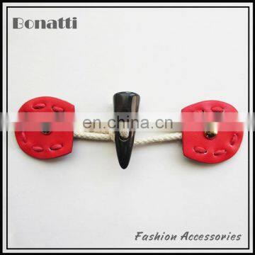 fancy red horn toggle button with rivet