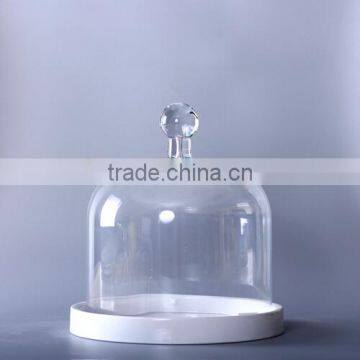 large bell jar with white base