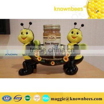 cartoon character bee fiberglass sculpture with honey bottle